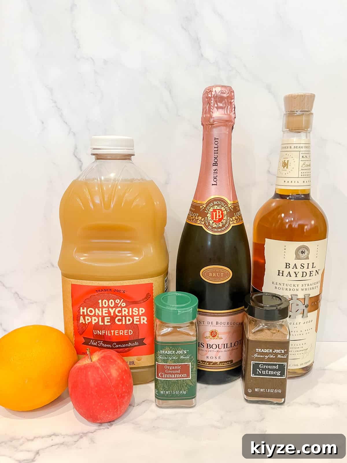 Ingredients needed to make spiked a apple cider cocktail.