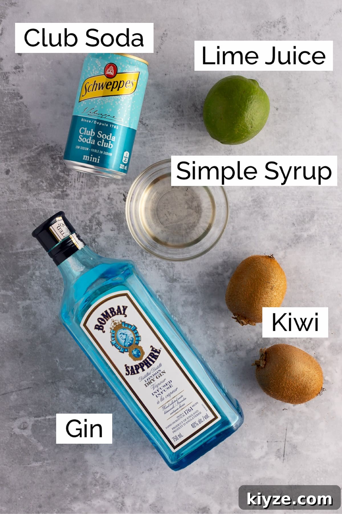 Refreshing Kiwi Gin Cocktail Recipe for Summer Sips 4 Overhead view of the ingredients needed to make the kiwi gin cocktail.