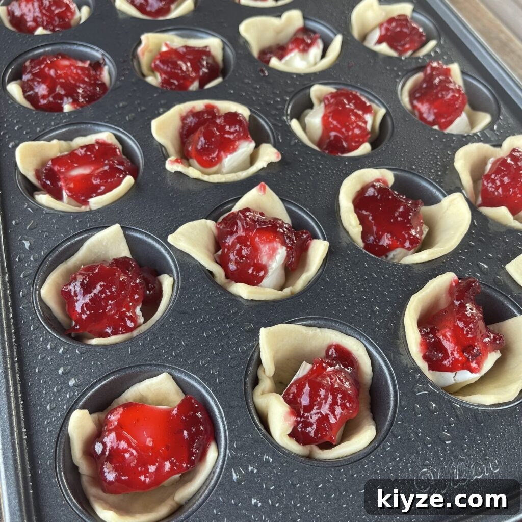 Crispy Grilled Brie Bites with Honey and Rosemary 8 Assembled brie bites in muffin tin