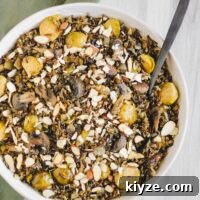 Slow Cooker Wild Rice Pilaf Recipe for Perfectly Fluffy Rice 8 overhead view of finished pilaf in large serving bowl sprinkled with sliced almonds