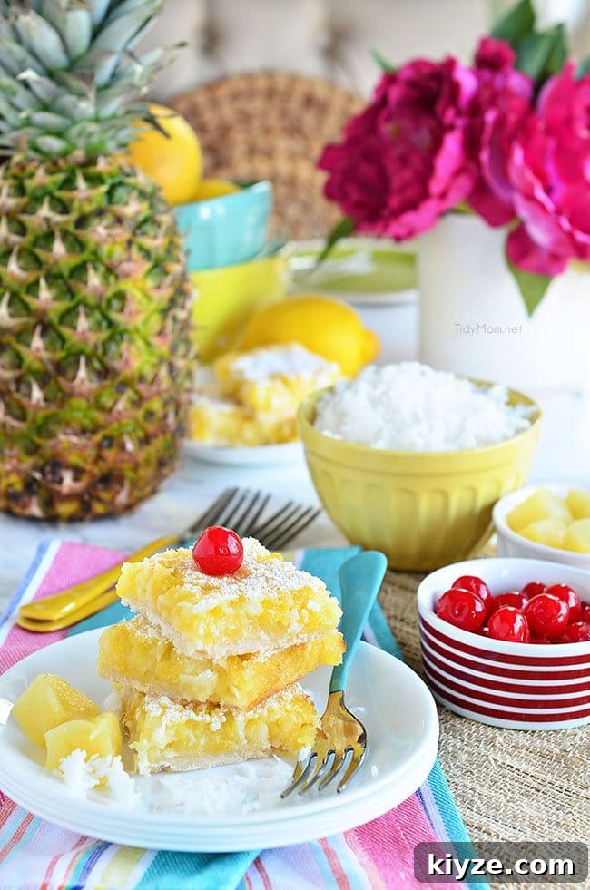 Pineapple Coconut Dessert Bars (Piña Colada) + Video 4 Channel the tropics, lounging on a white sandy beach, with these Pina Colada Bars.