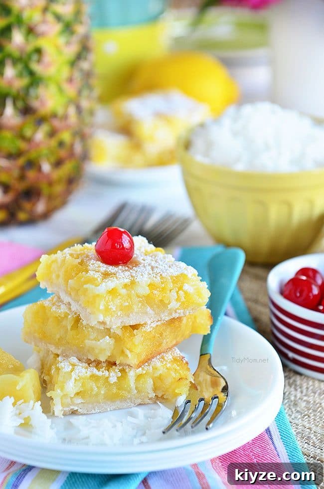 Pineapple Coconut Dessert Bars (Piña Colada) + Video 7 Channel the tropics, lounging on a white sandy beach, with these Pina Colada Bars.