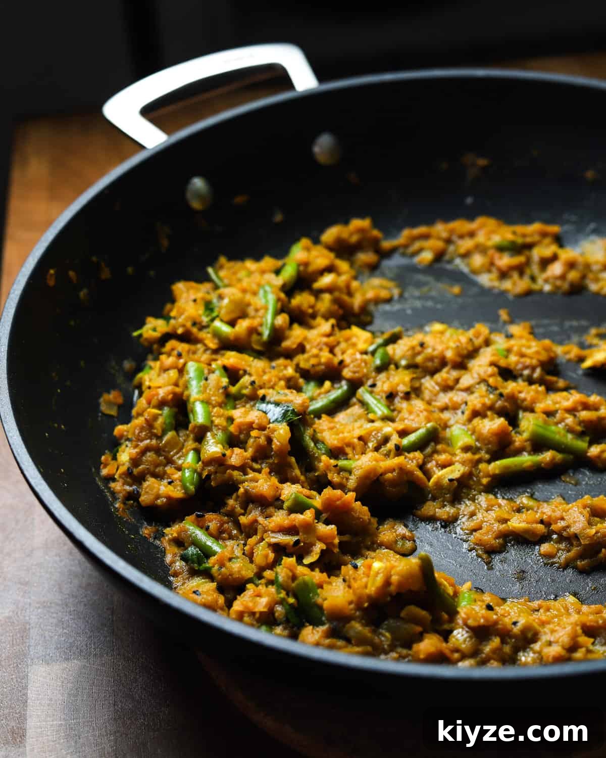 North Indian Pumpkin and Green Bean Curry (Vegan) 6 photo of a pan of pumpkin curry half eaten.