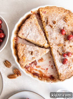 nantucket pie in tart pan with two slices cut.