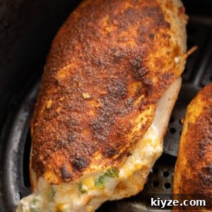 This easy Air Fryer Stuffed Chicken Breast recipe is perfect for a busy weeknight! Naturally gluten free, low carb, and bursting with cheesy, spicy flavor!