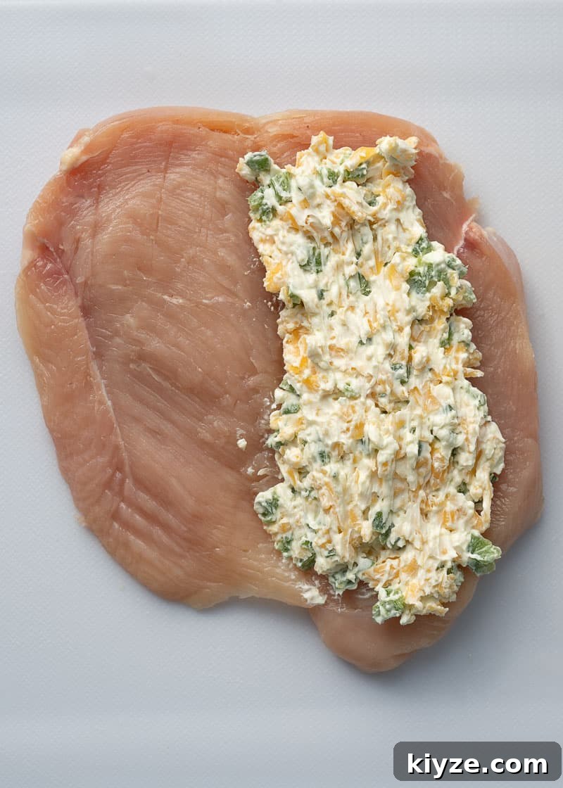 butterflied chicken breast with a creamy jalapeno cheese mixture spread on one side