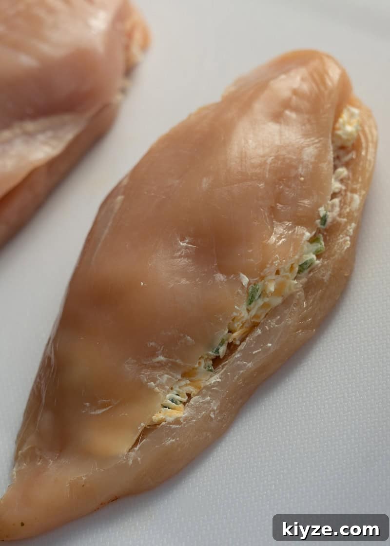 raw chicken breast stuffed with creamy, cheesy jalapeno mixture