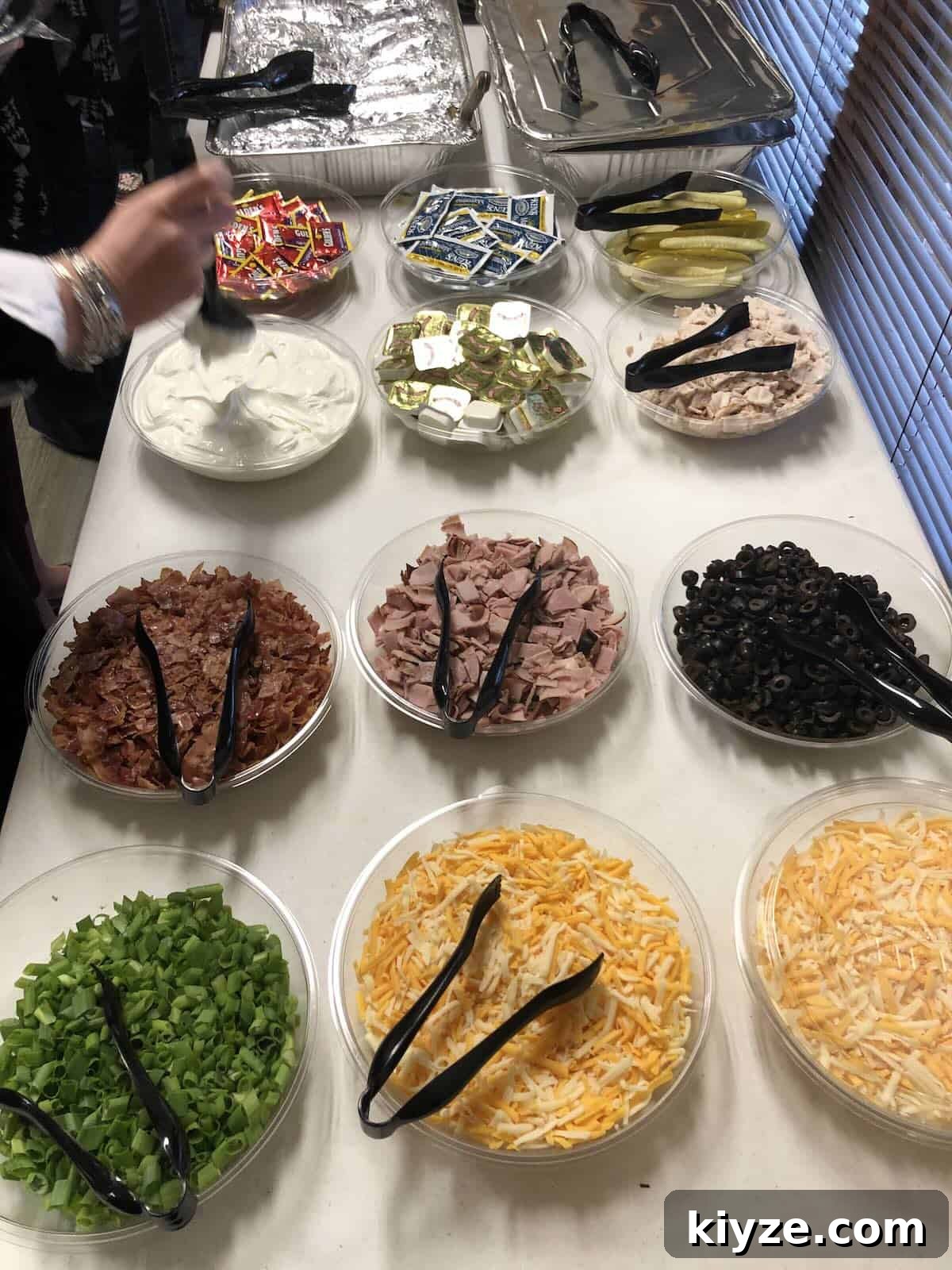 Graduation Party Menu Ideas: 6 Crowd-Pleasing Meal Plans 4 A baked potato bar with toppings like cheese, sour cream and bacon bits.