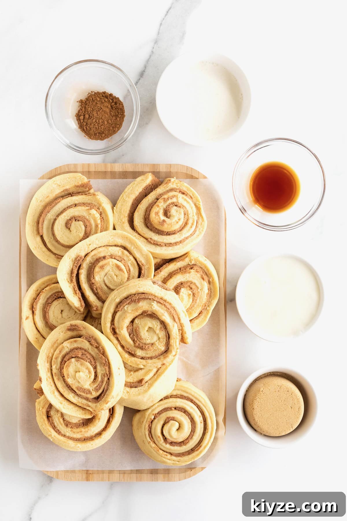 Quick Canned Cinnamon Rolls: Fast Oven & Air Fryer Hack 6 Ingredients to make the Canned Cinnamon Roll Hack in glass dishes on a white marble counter.