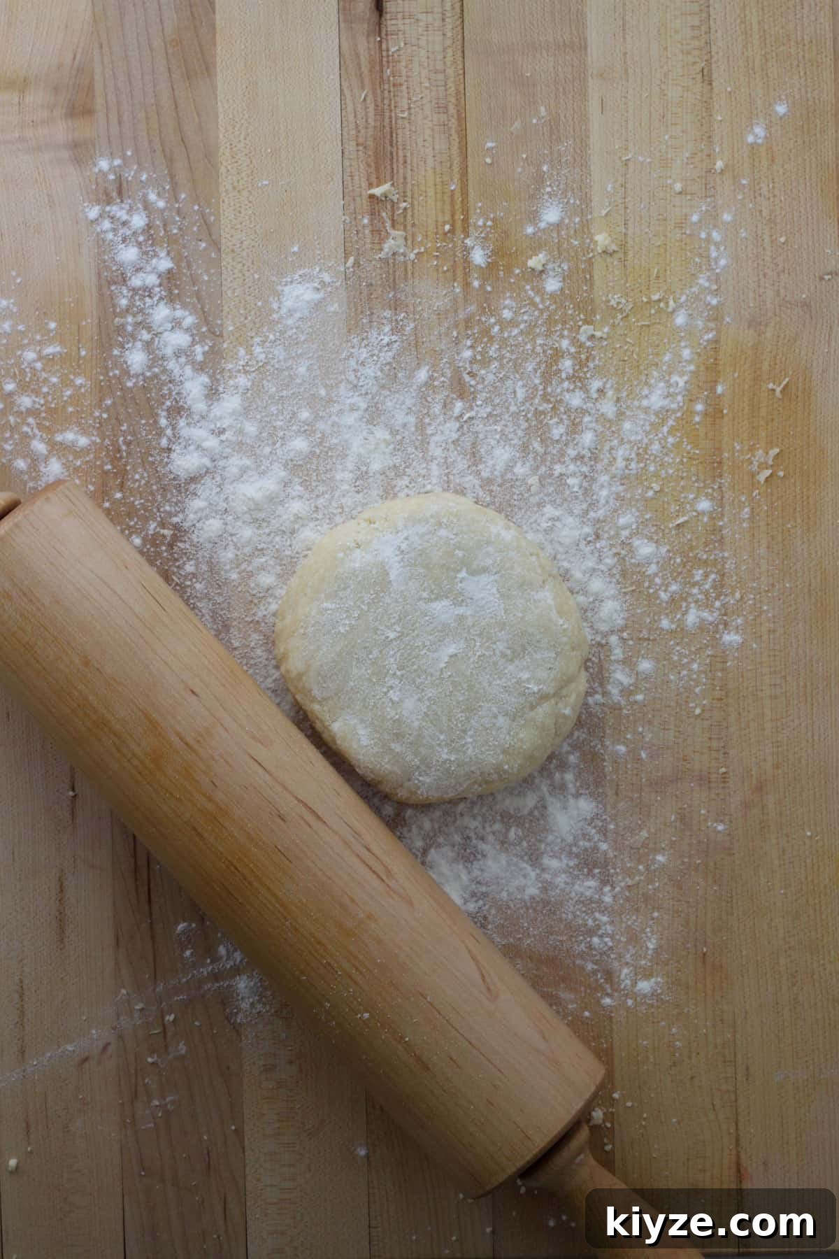Butter Pie Crust Made in a Food Processor: Quick Recipe 2 Butter pie dough on a floured work surface with a rolling pin.