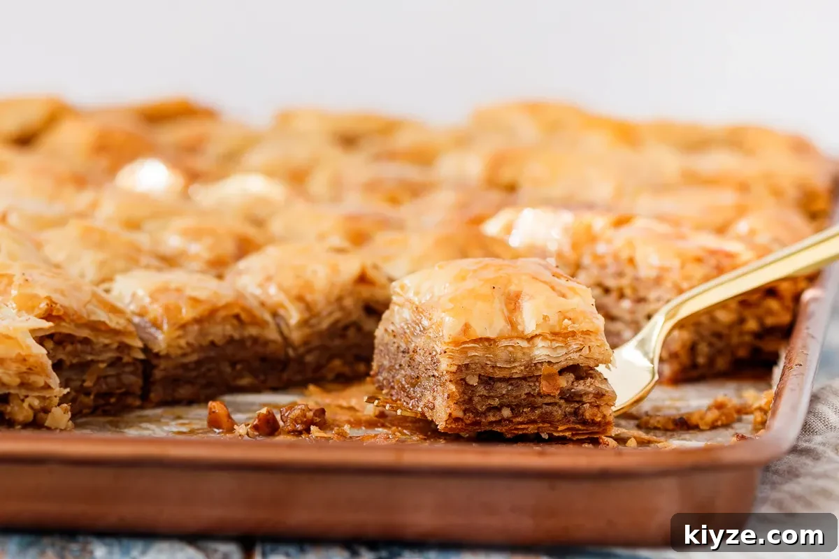 side shot of the baklava on a fork to show off layers