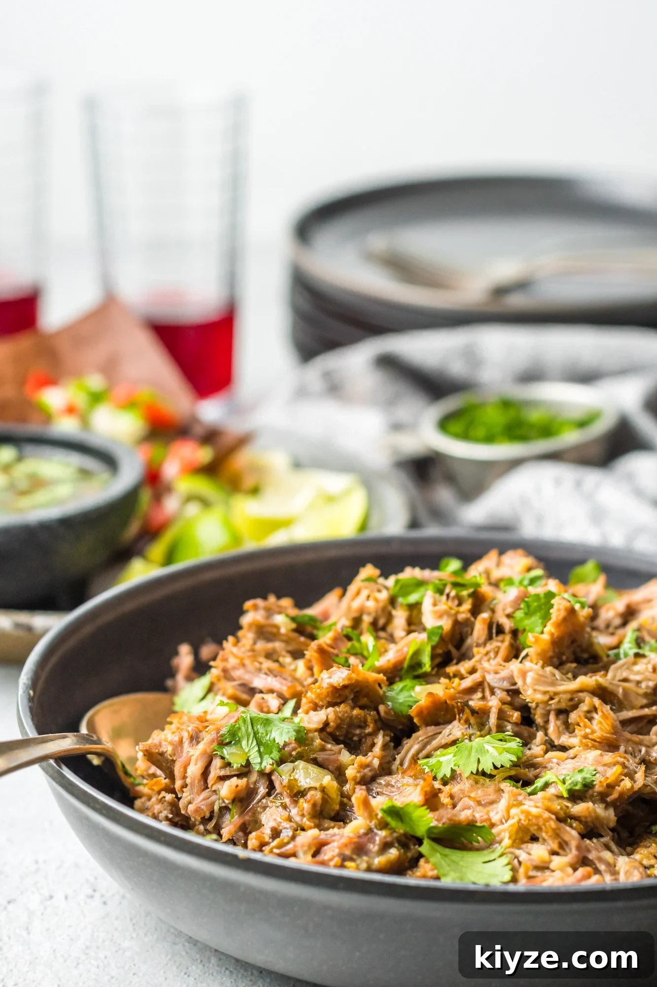 Juicy Instant Pot Pork Roast with Garlic and Herbs 3 Instant Pot Pork Roast with spoon