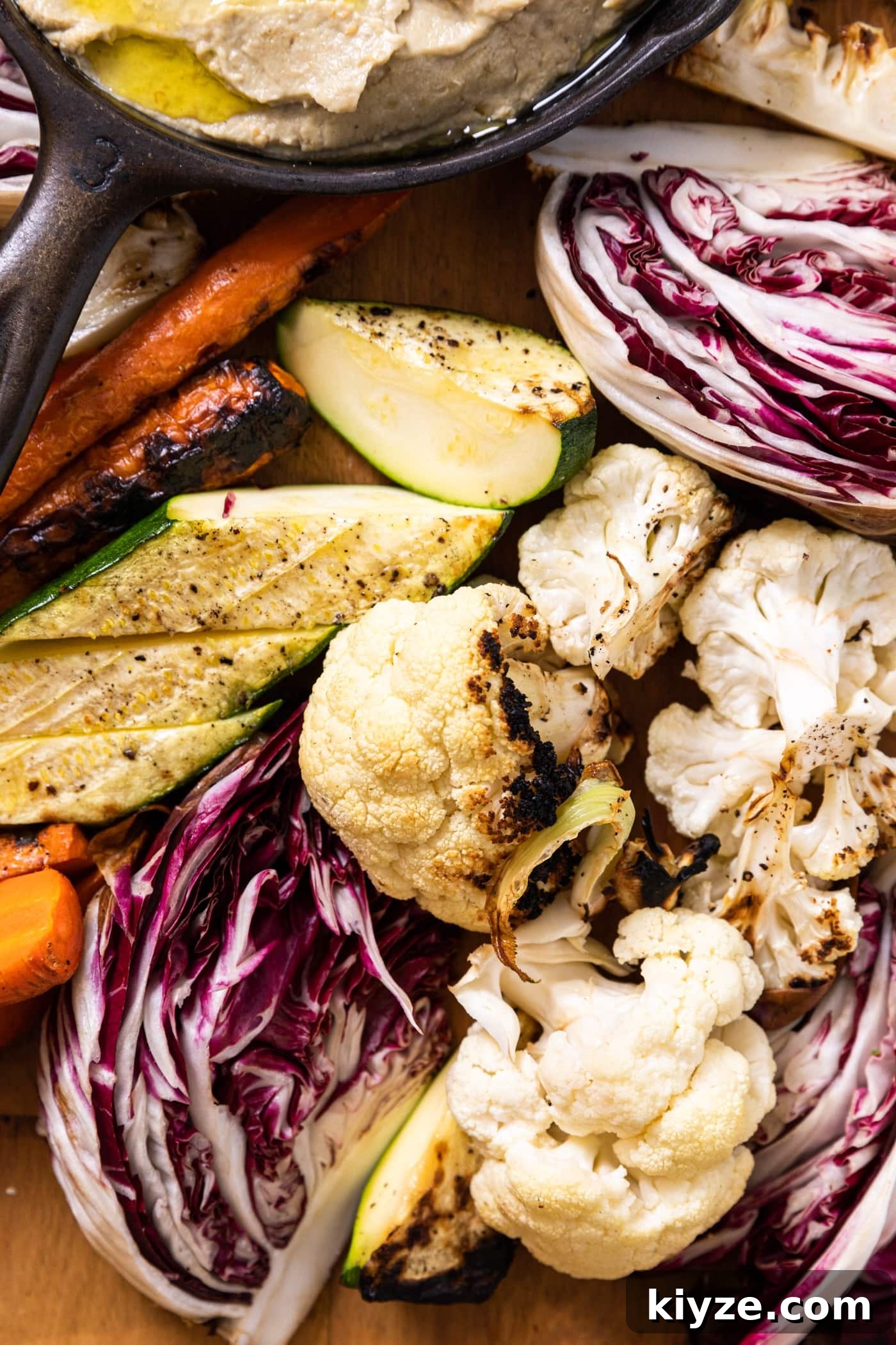 Authentic Baba Ganoush Recipe: Smoky Eggplant Dip Guide 5 Assortment of grilled vegetables including zucchini, cauliflower, and carrots sitting on wood board