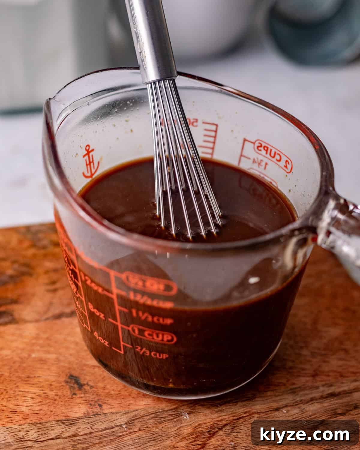 Mongolian Beef Noodles with Ground Beef and Scallions 4 mongolian beef sauce in a measuring cup.