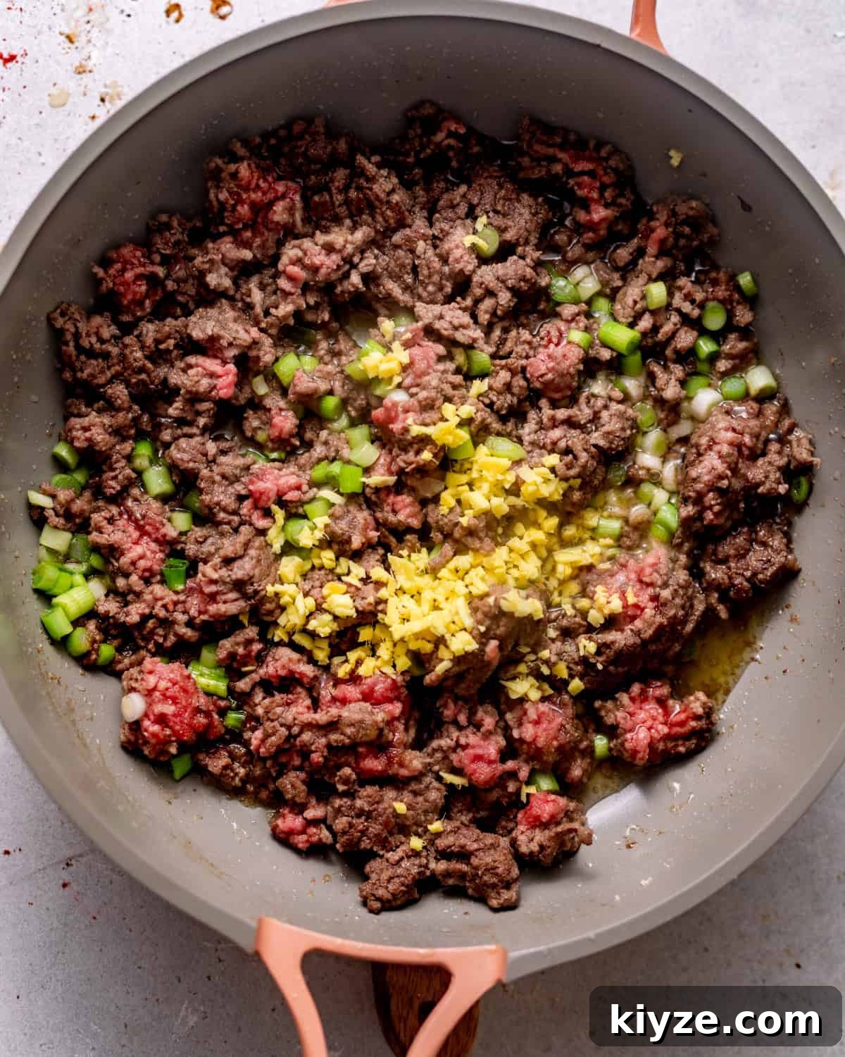 Mongolian Beef Noodles with Ground Beef and Scallions 5 ground beef in a skillet with garlic, ginger, and scallions.