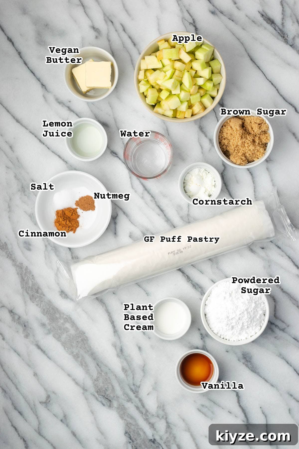 Flaky Apple Turnovers with Puff Pastry Recipe 3 Ingredients for puff pastry apple turnovers sitting on a marble countertop.