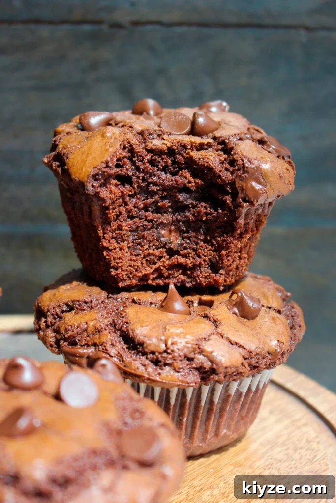 Fudgy Brownie Muffins Recipe: Chocolate Muffins with Gooey Centers 17 Stack of brownie muffins