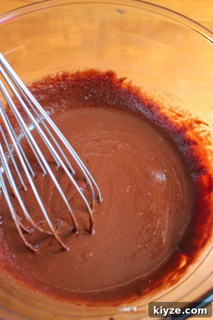 Fudgy Brownie Muffins Recipe: Chocolate Muffins with Gooey Centers 7 Batter texture
