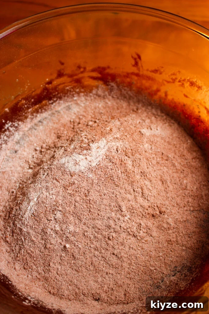 Fudgy Brownie Muffins Recipe: Chocolate Muffins with Gooey Centers 10 Folding dry ingredients
