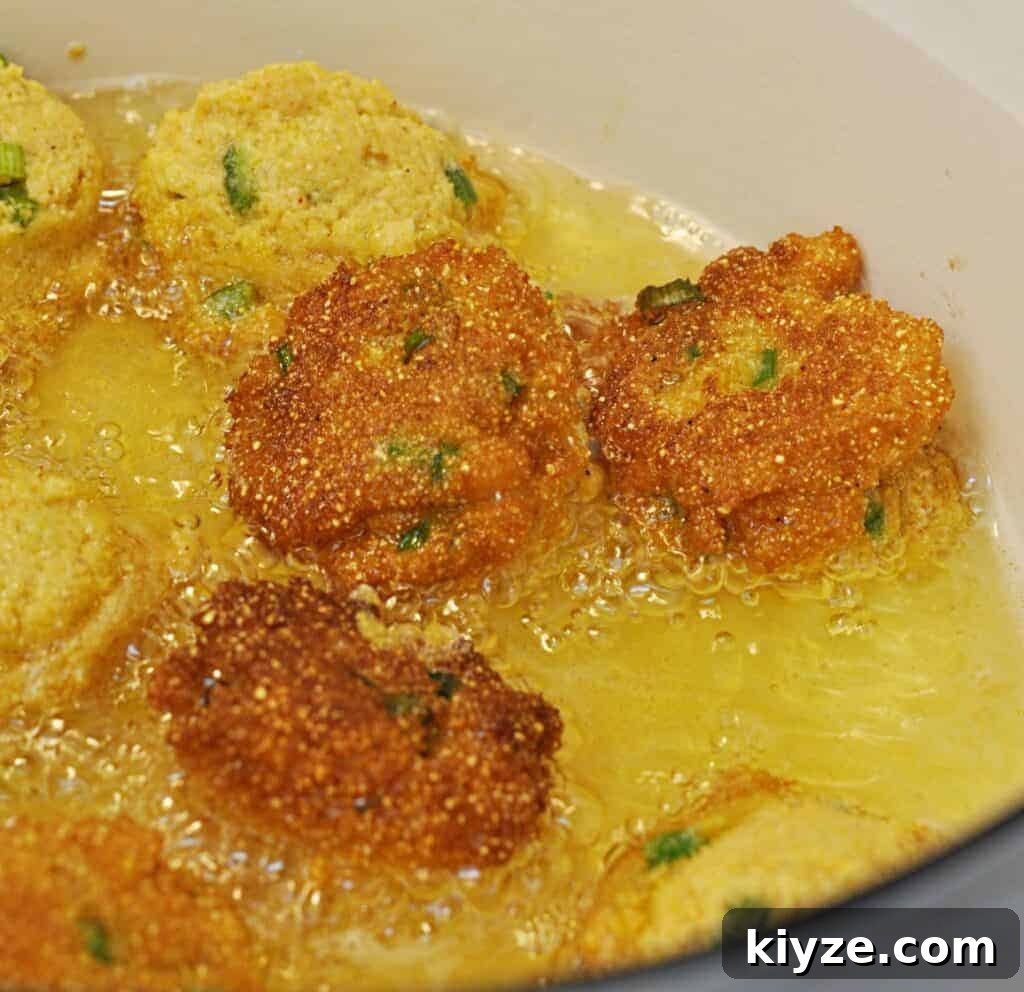 Zesty Jalapeño Hush Puppies Recipe — Quick Southern Corn Fritters 4 Hush Puppies frying in Dutch oven