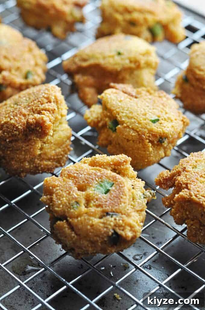 Zesty Jalapeño Hush Puppies Recipe — Quick Southern Corn Fritters 6 Hush Puppies draining on wire rack