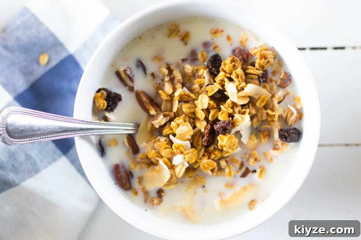 Pumpkin Spice Granola Recipe Made from Scratch 2 A bowl of homemade pumpkin granola with milk.