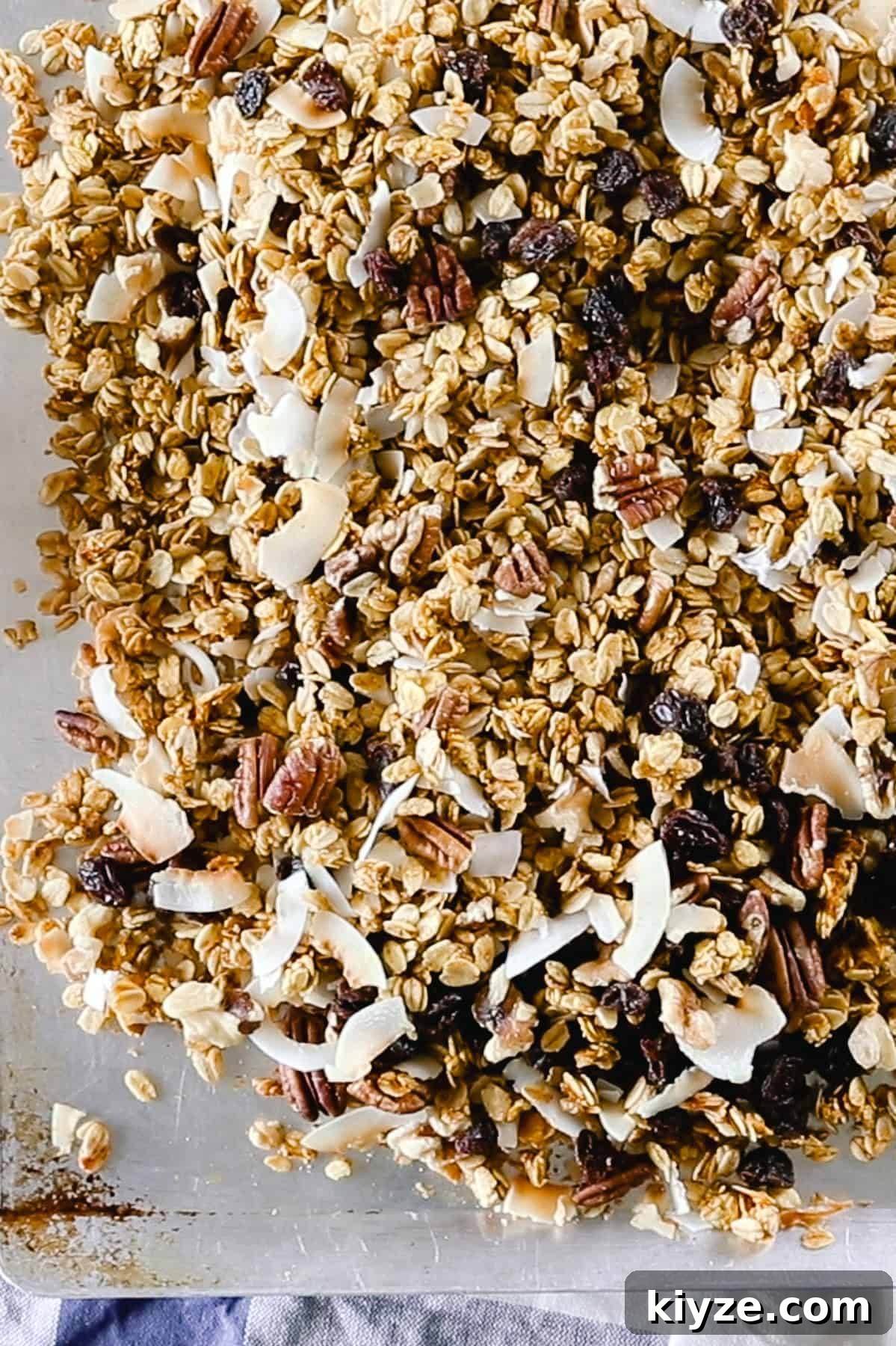 Pumpkin Spice Granola Recipe Made from Scratch 6 Adding the nuts and fruit to a sheet pan of granola.