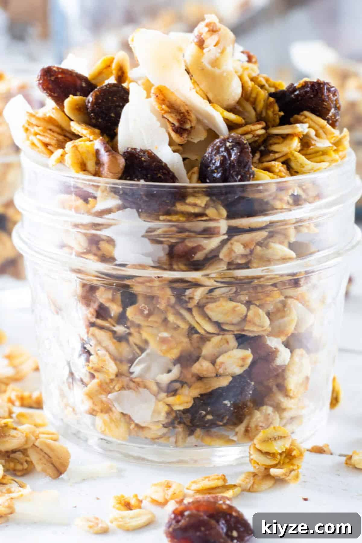 Pumpkin Spice Granola Recipe Made from Scratch 9 A jar of homemade pumpkin granola with yogurt.