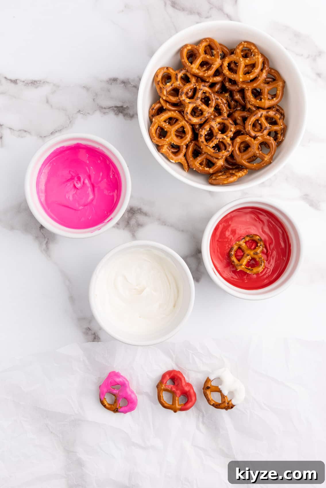 dipping pretzel in red melted wafers