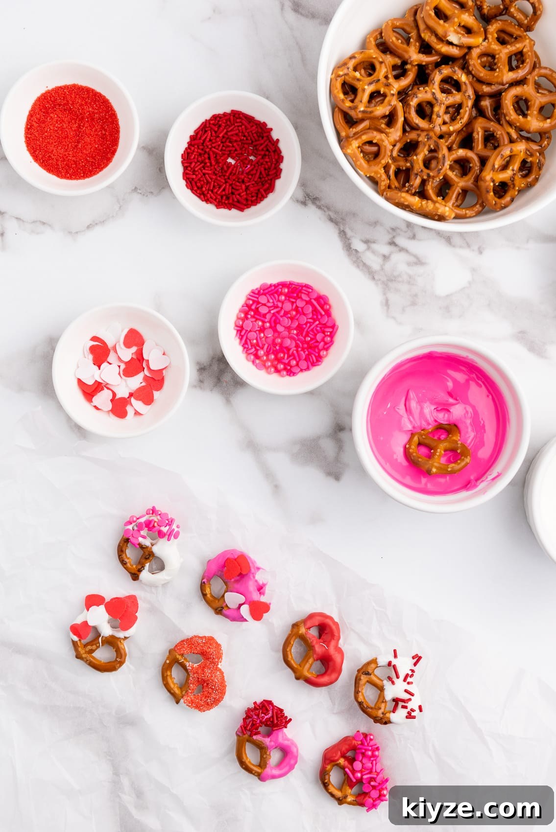 pretzels, red pink and white melted wafers, and valentines sprinkles