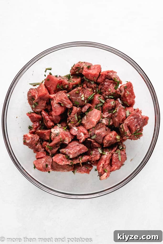 Hearty Beef Stew in Rich Tomato Sauce 4 Stew meat and spices tossed together in a bowl.