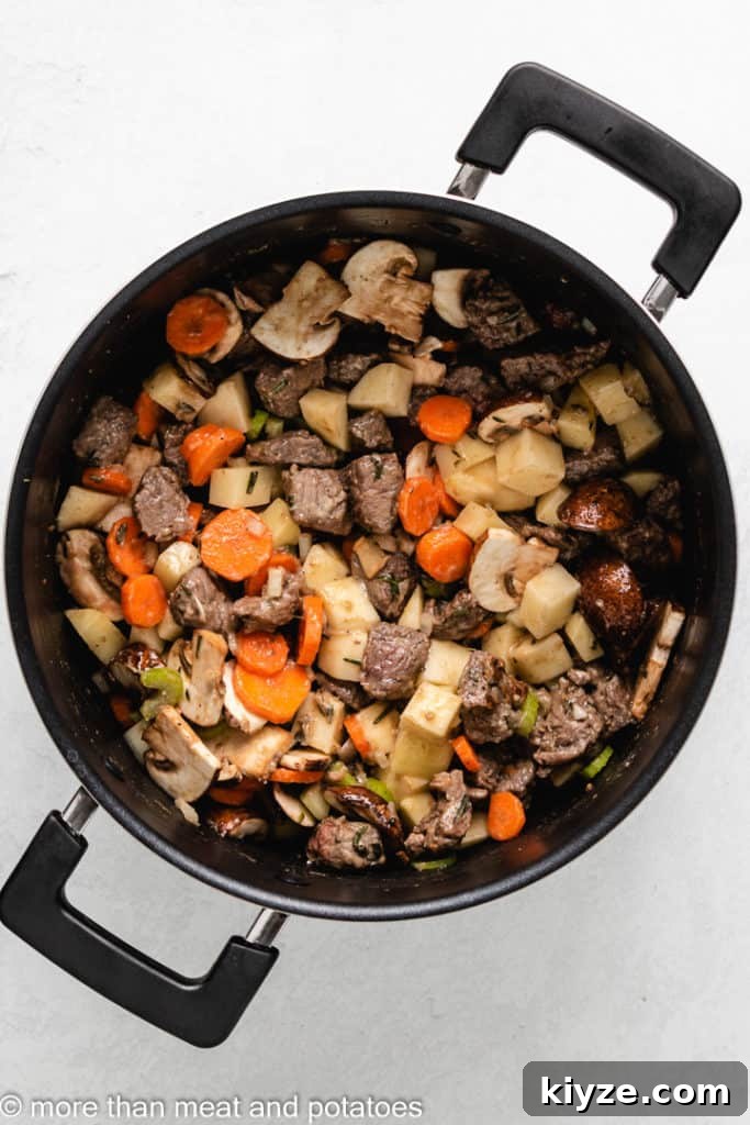Hearty Beef Stew in Rich Tomato Sauce 7 Potatoes, carrots, and other vegetables added to the pot.