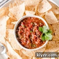 chipotle restaurant style salsa in a bowl surrounded by chips.