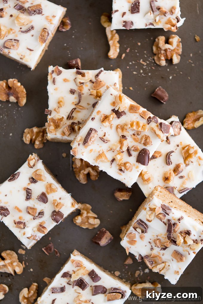 Cream Cheese Blondie Bars Recipe — Gooey, Chewy Dessert Bars 3 Cream Cheese Blondie Bars topped with chopped walnuts and toffee bits