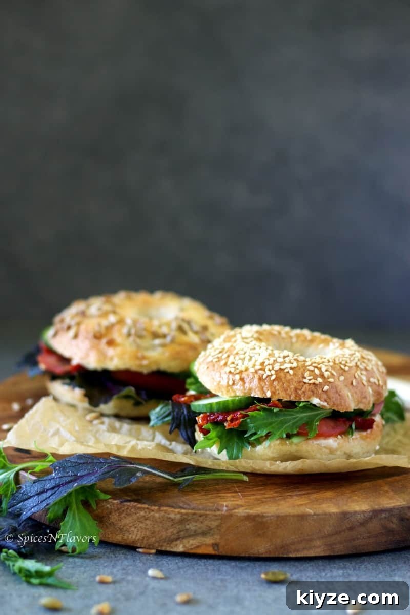 Homemade Bagels: A 5-Step Recipe for Perfect Chewy Bagels 10 bagel sandwiches placed on a wooden serving board