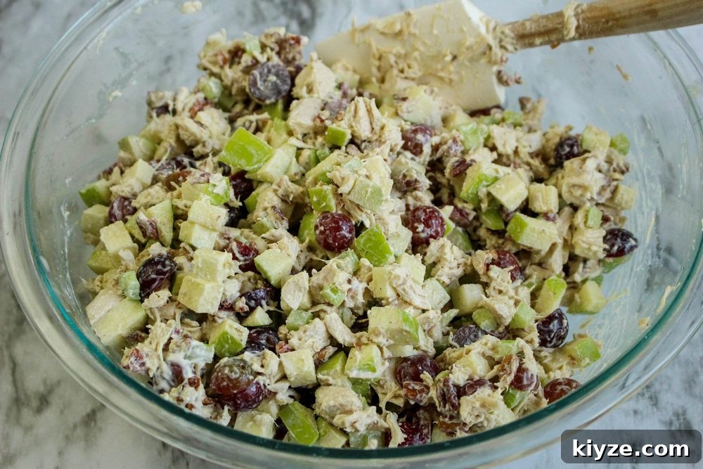 Chicken Salad with Grapes, Apples & Pecans — Light Recipe 5 Large clear bowl of mixed Healthier Chicken Salad with grapes, apples and pecans