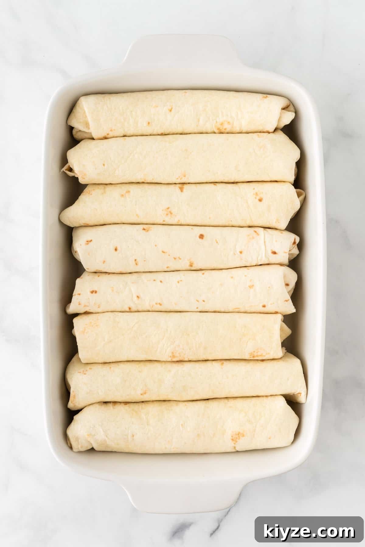 Sweet Potato and Black Bean Enchiladas with Chipotle Sauce 12 rolled up enchiladas in a baking dish