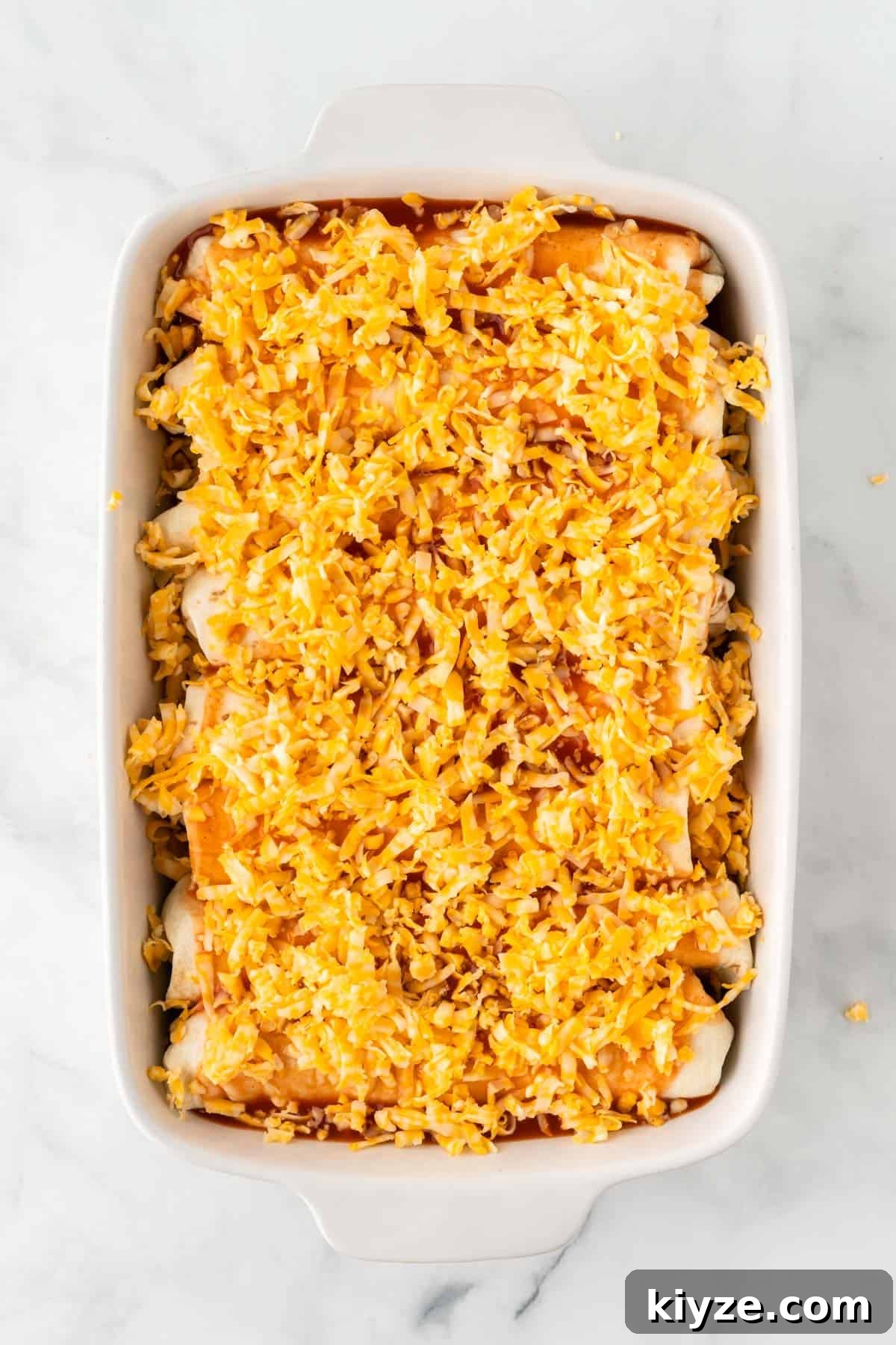 Sweet Potato and Black Bean Enchiladas with Chipotle Sauce 14 colby jack cheese sprinkled on the top of the enchiladas