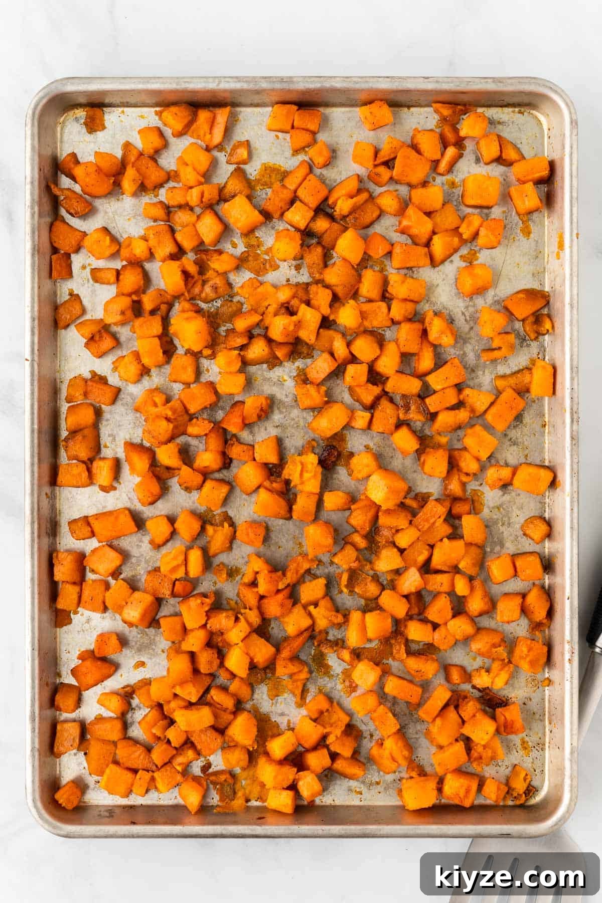Sweet Potato and Black Bean Enchiladas with Chipotle Sauce 6 roasted cubed sweet potatoes on a baking sheet