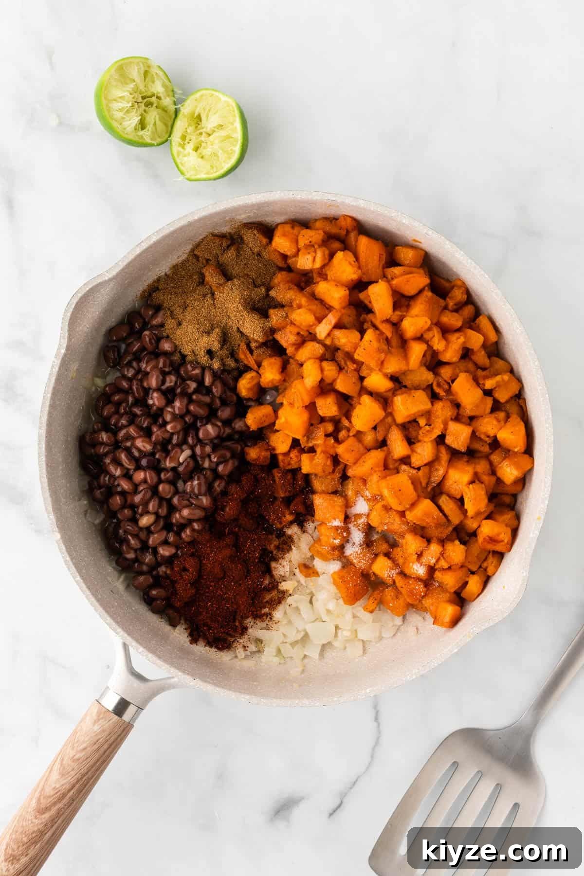 Sweet Potato and Black Bean Enchiladas with Chipotle Sauce 9 adding the roasted sweet potatoes, black beans, and spices to the skillet