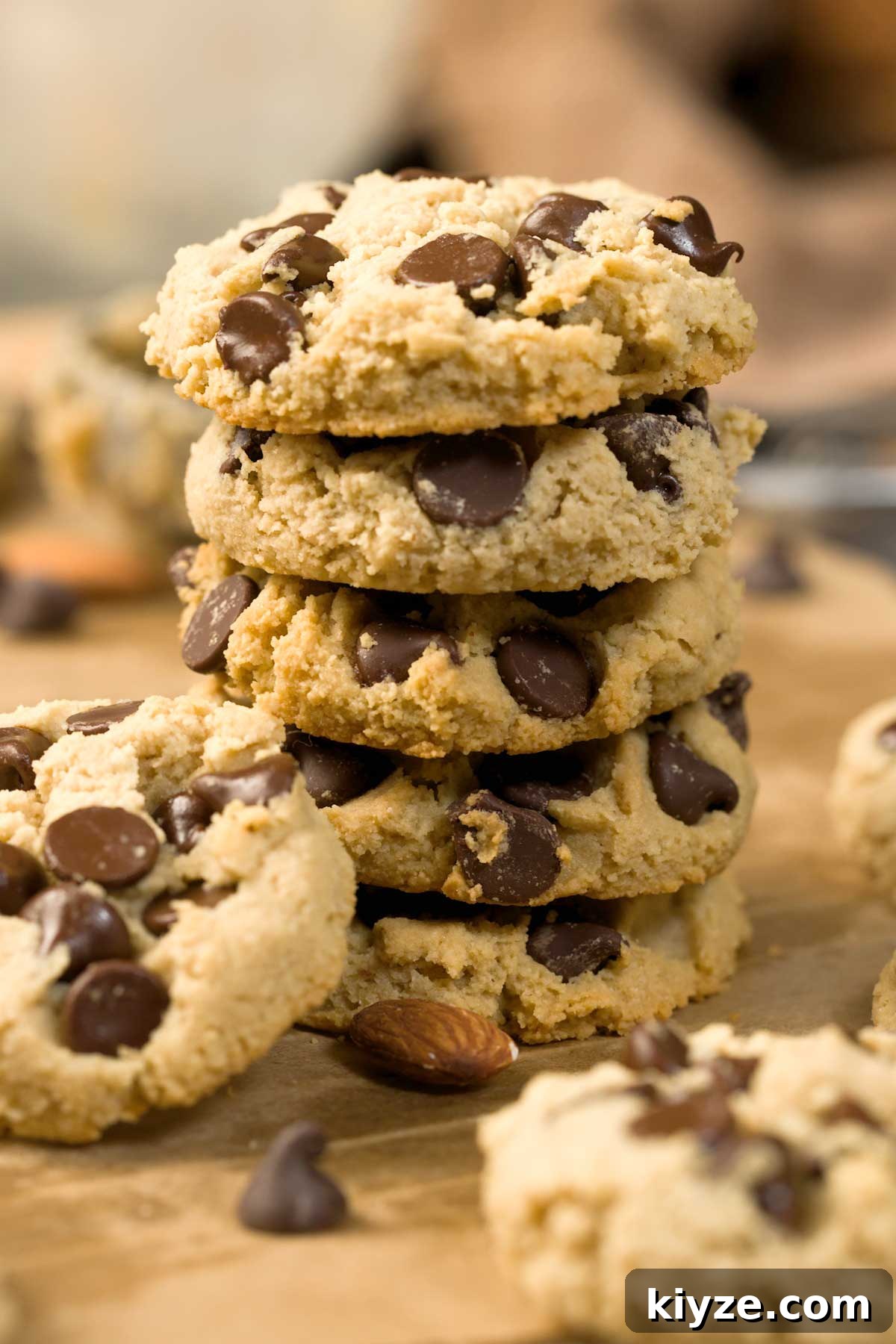 Almond Flour Chocolate Chip Cookies (Gluten-Free Recipe) 3 Gluten-free chocolate chip cookies on a cookie sheet.