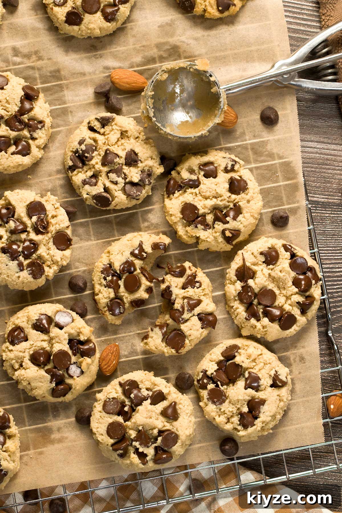 Almond Flour Chocolate Chip Cookies (Gluten-Free Recipe) 4 Gluten-free chocolate chip cookies on a cookie sheet.