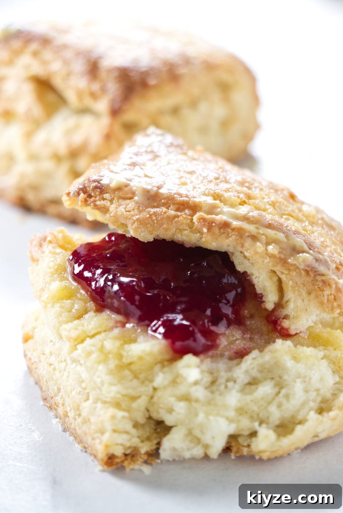 Flaky Sour Cream Biscuits Recipe for Perfect Homemade Biscuits 3 A sour cream biscuit with strawberry jam.