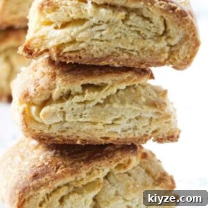 Stack of three sour cream biscuits on a counter.