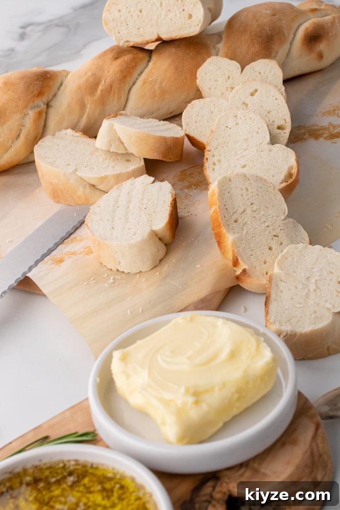 30-Minute Crusty Baguettes: Foolproof Recipe for Homemade Bread 3 foolproof baguette slices on a sheet of brown parchment paper