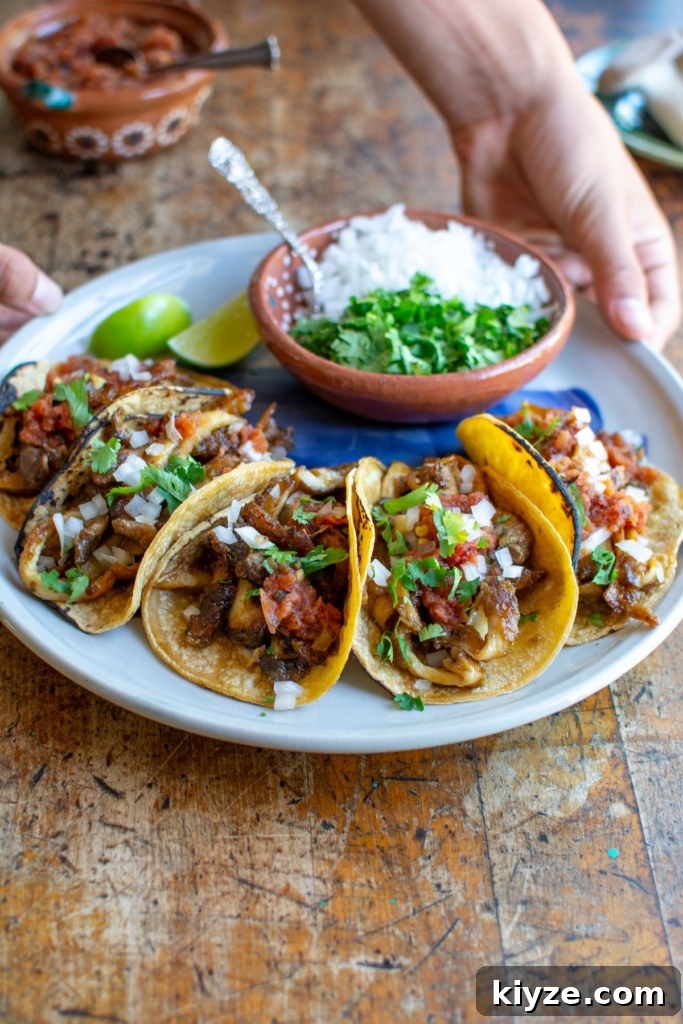 Vegan Oyster Mushroom Carnitas Tacos — Smoky Plant-Based Filling 2 A plate of mushroom carnitas tacos