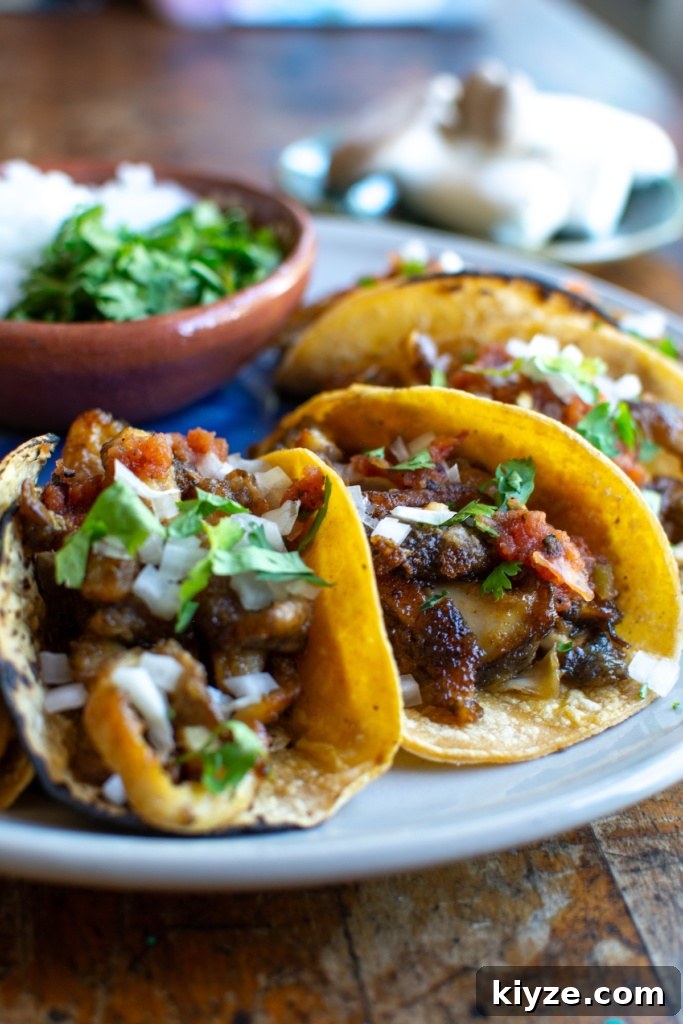 Vegan Oyster Mushroom Carnitas Tacos — Smoky Plant-Based Filling 11 A plate of mushroom carnitas tacos
