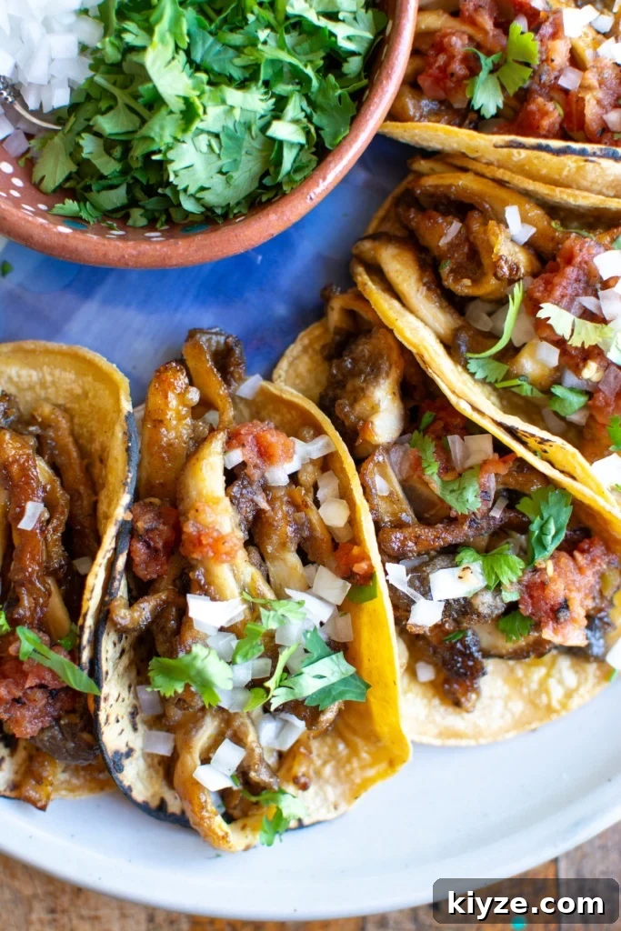 Vegan Oyster Mushroom Carnitas Tacos — Smoky Plant-Based Filling 19 A plate of vegan oyster mushroom tacos