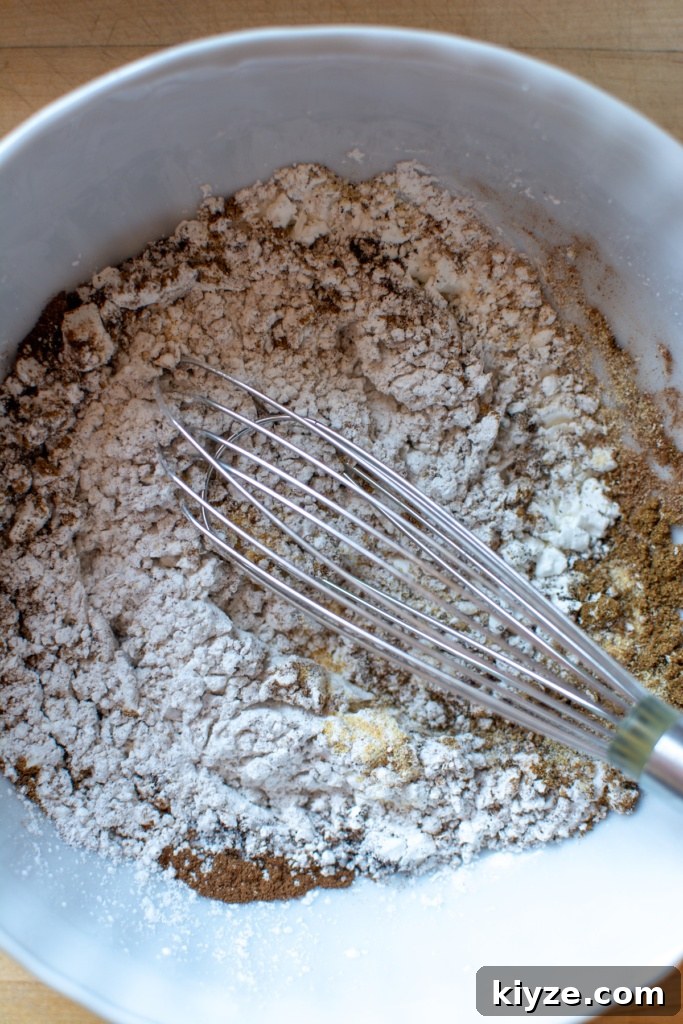 Vegan Oyster Mushroom Carnitas Tacos — Smoky Plant-Based Filling 5 a cornstarch mixture with a whisk in it