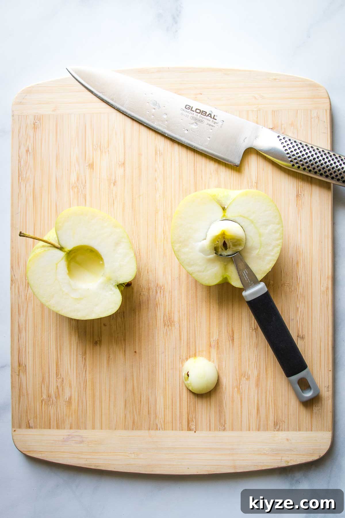 Green apple, halved and then the inner core scooped out with a melon baller.